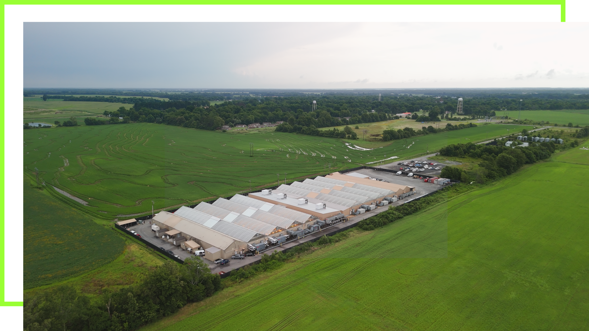 Aerial view of BOLD Cannabis cultivation facility in Cotton Plant Arkansas showing large commercial greenhouse operation surrounded by agricultural farmland.
