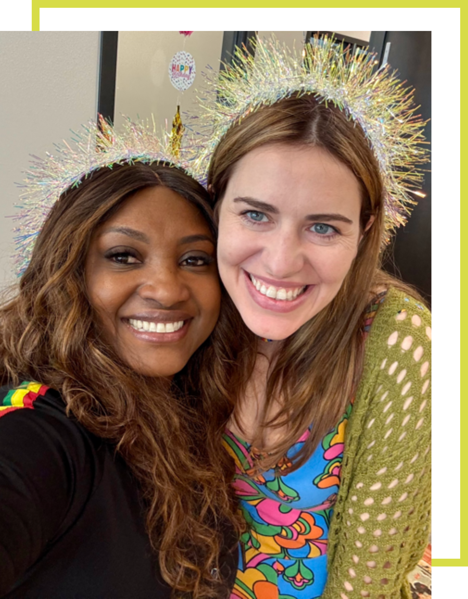 Rochelle Bradshaw and Amanda Strickland, CEO of The Source cannabis dispensary celebrating with tinsel party crowns at an event.